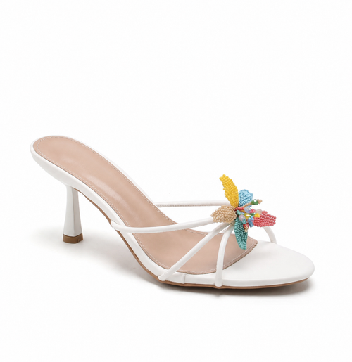Mules blanches à fleur perlée multicolore, vue de profil